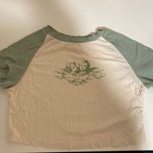 very cute tank top; angle graphic and green and cream color; very soft; shein
